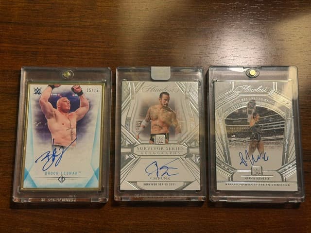 Brock Lesnar, CM Punk and Rhea Ripley autographed cards